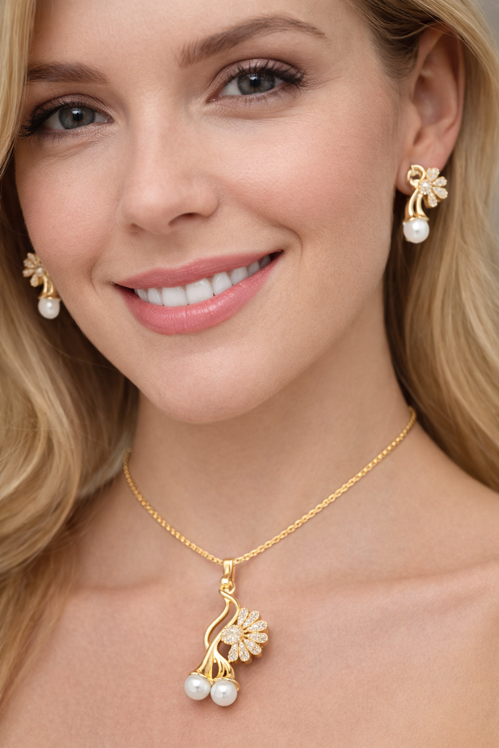 Shop floral pearl pendant set with crystal detailing. Elegant gold jewellery by Vellorene perfect for gifting and daily wear.
