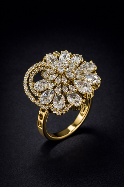 gold spiral floral statement ring with crystal detailing. Premium Vellorene fashion jewellery for boutique and global buyers.