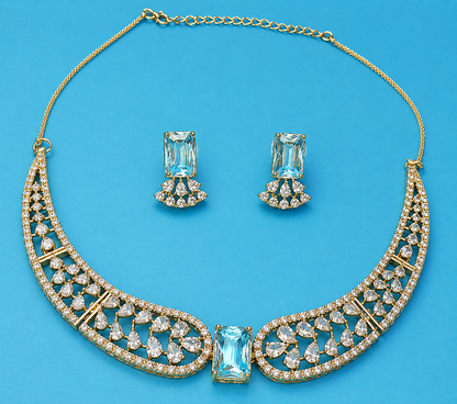 Ice blue crystal statement necklace set with matching earrings, elegant gold tone jewelry for weddings and evening wear