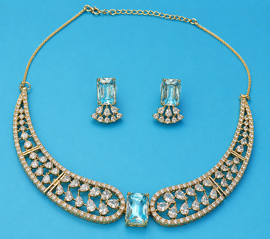 Ice blue crystal statement necklace set with matching earrings, elegant gold tone jewelry for weddings and evening wear