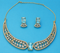 Ice blue crystal statement necklace set with matching earrings, elegant gold tone jewelry for weddings and evening wear
