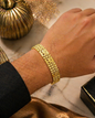 Obsidyn gold multi link bracelet with geometric detailing on display surface