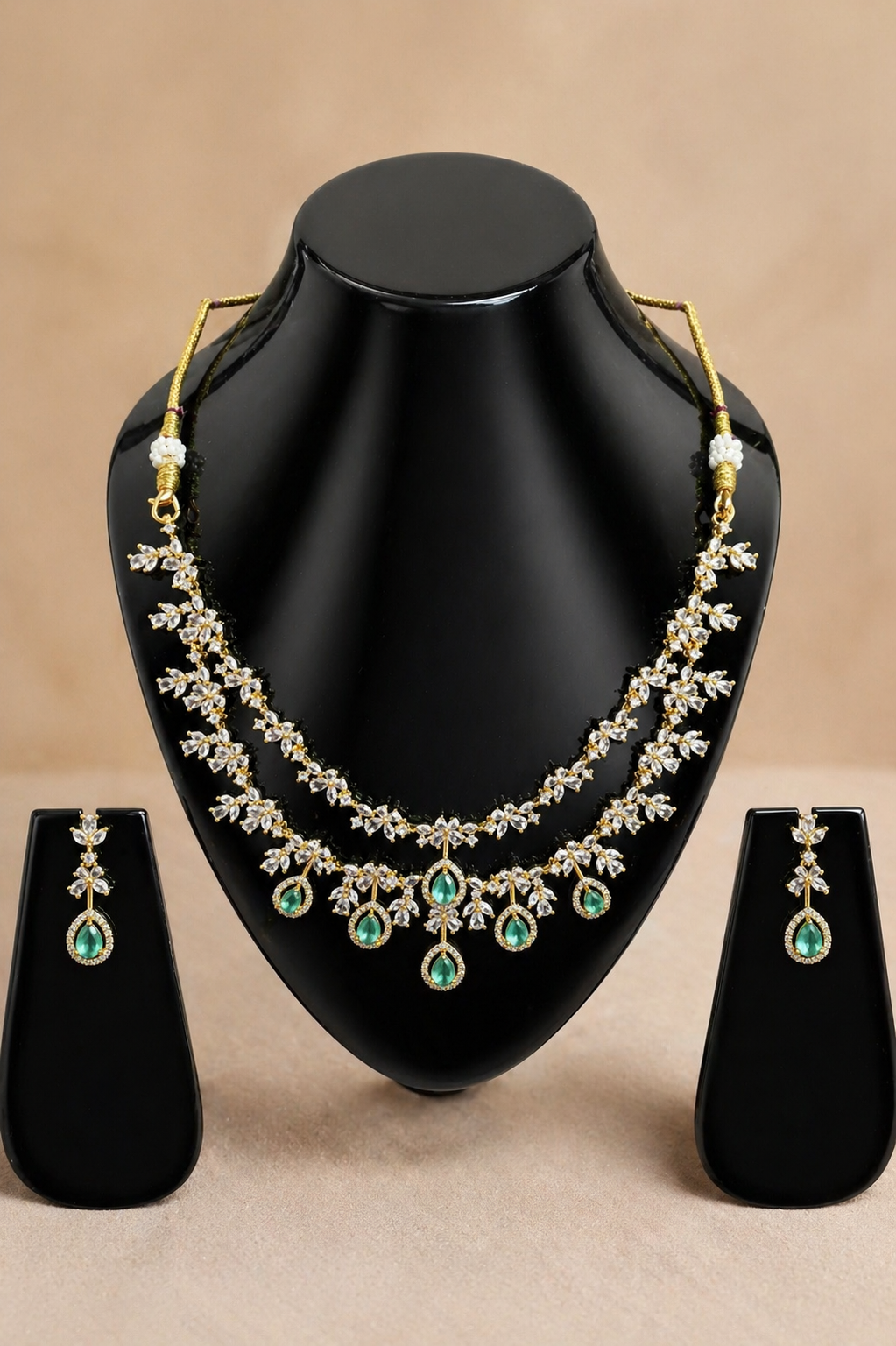 Emerald drop necklace set with crystal floral design and matching earrings