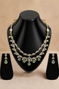 Emerald drop necklace set with crystal floral design and matching earrings
