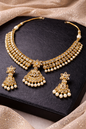 Kundan pearl necklace set with statement pendant and matching earrings traditional bridal jewelry